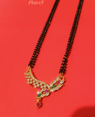 N0186_Elegant style mangalsutra with delicate craft work design pendant studded with American Diamond stones with a touch of pink and green ruby stones.