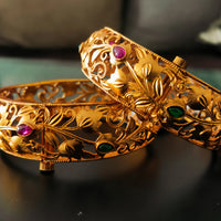 B045_Gorgeous Matte Gold  plated bangles studded with pink and green ruby stones.
