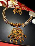 N0194_Gorgeous Temple jewelry style Micro Gold matte polish Necklace set with delicate art work of swan embossed design studded with a touch of semi Precious pink & green stones along with golden bead drops.