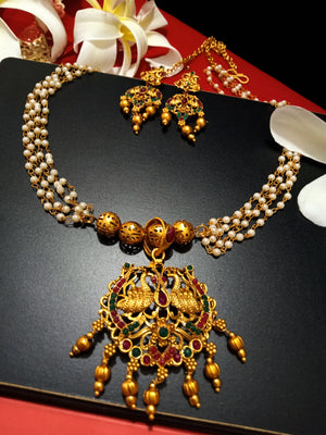 N0194_Gorgeous Temple jewelry style Micro Gold matte polish Necklace set with delicate art work of swan embossed design studded with a touch of semi Precious pink & green stones along with golden bead drops.