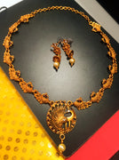 N0199_Elegant Temple jewelry style Micro Gold matte polish necklace set with delicate art work of peacock design over sized pendant studded with a touch of  pink & green stones along with pearl drops.