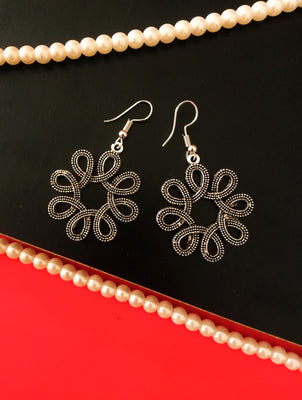 E0528_ Elegant German Silver oxidized crafted floral shaped earring with delicate art work (medium size).