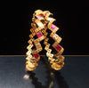 B019_Gorgeous Gold plated Bangles studded with white and pink ruby stones set of 2