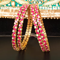 B022_S_Classy Style Gold plated Bangles studded with American Diamond stones .