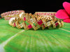 B019_Gorgeous Gold plated Bangles studded with white and pink ruby stones set of 2