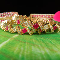 B019_Gorgeous Gold plated Bangles studded with white and pink ruby stones set of 2