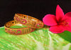 B0118_Classic Style one gram gold Plated along with pink ruby studded Bangles for Women Set of 2.