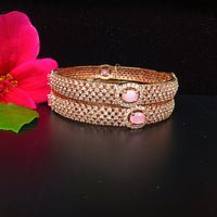 B038_Classy Style Rose Gold bangle studded with American Diamond stones with a touch of emerald.