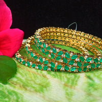 B061_Gorgeous Gold plated bangles studded with  American Diamond stones.