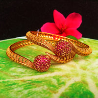 B069_Gorgeous Gold plated bangles studded with pink ruby stones.