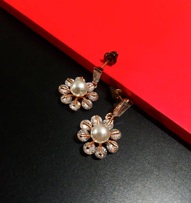 E0805_Elegant dazzling flower design rose gold american diamond stone studded earring with a touch of pearl.