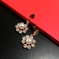 E0805_Elegant dazzling flower design rose gold american diamond stone studded earring with a touch of pearl.