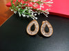 E0807_Lovely tear drop shaped gold color american diamond stone studded studs.