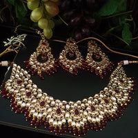 N0224_Classic Elaborated Kundan choker necklace set with floral designs and with a touch of glossy maroon  beads .