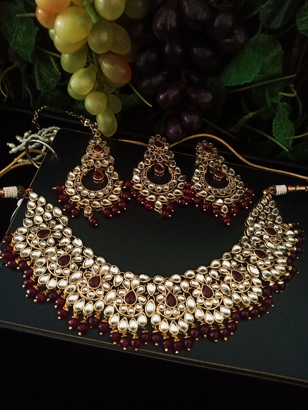 N0224_Classic Elaborated Kundan choker necklace set with floral designs and with a touch of glossy maroon  beads .