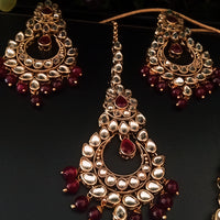 N0224_Classic Elaborated Kundan choker necklace set with floral designs and with a touch of glossy maroon  beads .