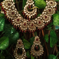 N0224_Classic Elaborated Kundan choker necklace set with floral designs and with a touch of glossy maroon  beads .