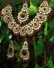 N0224_Classic Elaborated Kundan choker necklace set with floral designs and with a touch of glossy maroon  beads .