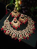 N0222_Classic Elaborated Kundan choker necklace set with floral designs and with a touch of glossy red beads .
