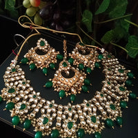 N0220_Classic Elaborated choker necklace set studded with Kundan stones with a touch of glossy green beads.