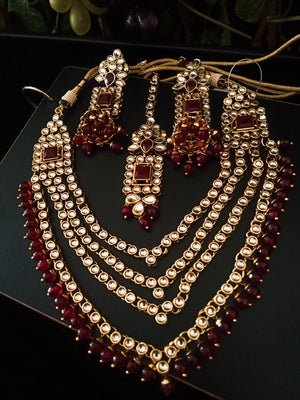 N0223_Classic Elaborated Layered choker necklace set studded with Kundan stones with a touch of glossy maroon beads.