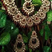 N0224_Classic Elaborated Kundan choker necklace set with floral designs and with a touch of glossy maroon  beads .