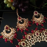 N0222_Classic Elaborated Kundan choker necklace set with floral designs and with a touch of glossy red beads .