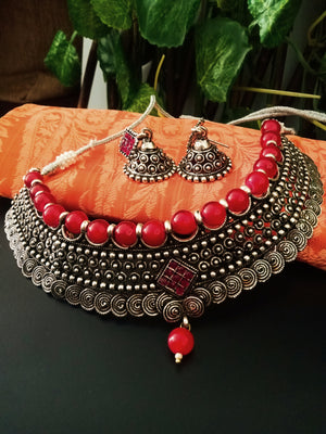 N0230_Grand German Silver Oxidized choker necklace set with delicate craft work pattern studded with red stones with a touch of red glossy beads.