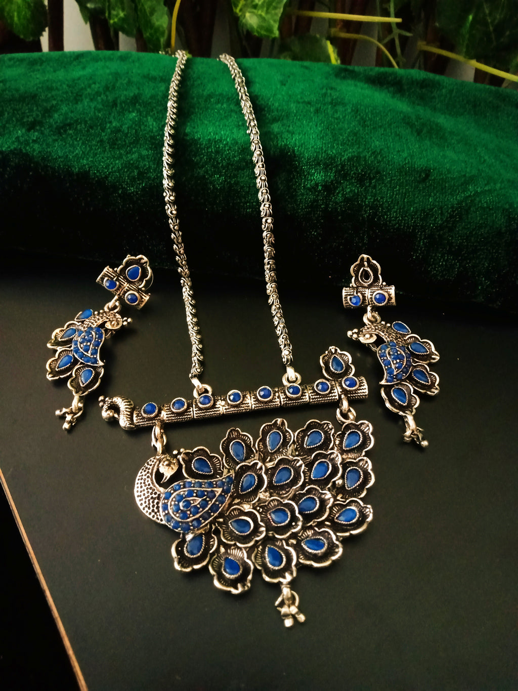 N0235_Classy German Silver Oxidized necklace set with delicate craft work peacock design shaped pendant studded with blue stones with a touch of beads.
