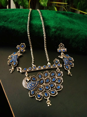 N0235_Classy German Silver Oxidized necklace set with delicate craft work peacock design shaped pendant studded with blue stones with a touch of beads.