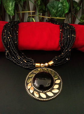 N0246_ Classic Off beat necklace with over sized circular pendant with a black color stone with beautiful craft work followed by layered bead chains.