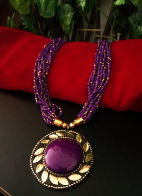 N0247_ Classic Off beat necklace with over sized circular pendant with a violet color stone with beautiful craft work followed by layered bead chains.