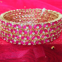 B022_S_Classy Style Gold plated Bangles studded with American Diamond stones .
