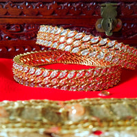 B013_Classy Style Gold Plated Bangles studded  with American Diamond stones.