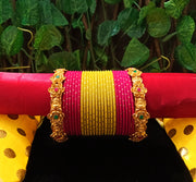 B0131_Exquisite bangles set with colorful metal bangles along with Matte gold plated bangles with delicate flower design.