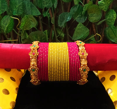 B0131_Exquisite bangles set with colorful metal bangles along with Matte gold plated bangles with delicate flower design.