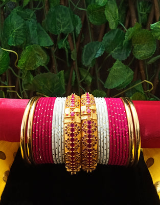 B0136_Gorgeous bangles set with Matte gold plated plain bangles and Grand delicate work bangles with a touch of stones.