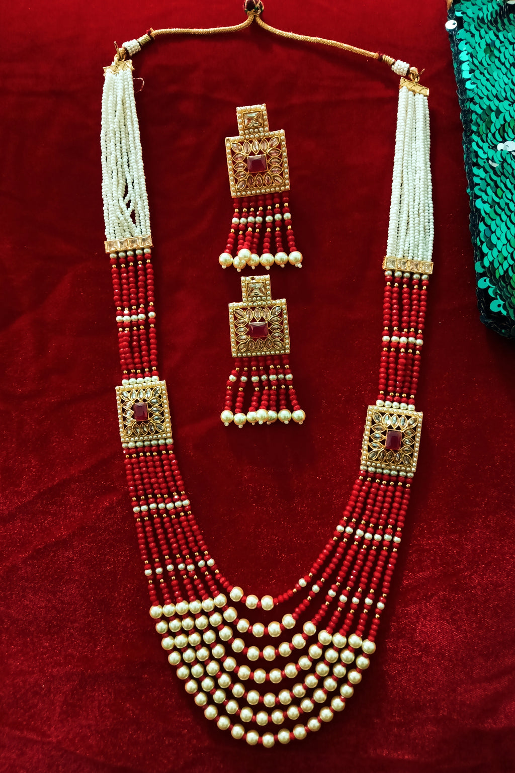 N0126_Classy Style Stunning Long Multilayered ‘Raani Haar’ Necklace set with off white pearls and red color crystal drops studded with American Diamond stones.
