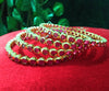 B0154_Elegant pink ruby studded bangles with fine stone work.
