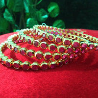 B0154_Elegant pink ruby studded bangles with fine stone work.