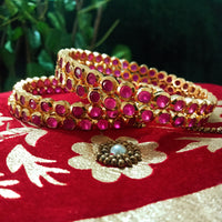 B0154_Elegant pink ruby studded bangles with fine stone work.