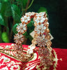B0155_S_Elegant Rose gold bangle with flower design studded with American Diamond stones.