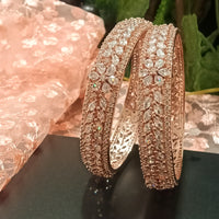 B0152_S_ Exquisite Rose Gold plated bangles with delicate art work studded with  American Diamond stones.