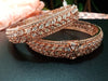 B0152_S_ Exquisite Rose Gold plated bangles with delicate art work studded with  American Diamond stones.