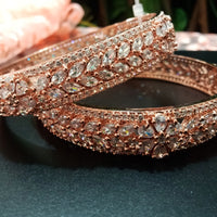 B0152_S_ Exquisite Rose Gold plated bangles with delicate art work studded with  American Diamond stones.