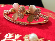 B0115_Elegant metal base color flower design bracelet studded with  stones (Free size).
