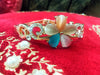 B0111_Elegant  metal base color flower design bracelet studded with  stones (Free size).