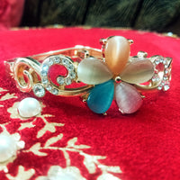 B0111_Elegant  metal base color flower design bracelet studded with  stones (Free size).