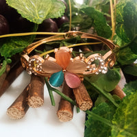 B0111_Elegant  metal base color flower design bracelet studded with  stones (Free size).