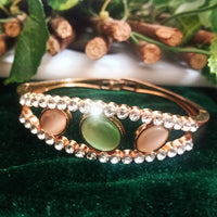 B0116_Elegant metal base color  bracelet studded with vibrant stones (Free size).
